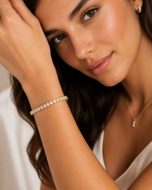 Woman wearing Celeste Luxury 14K Gold Laminated Tennis Bracelet with sparkling cubic zirconia stones